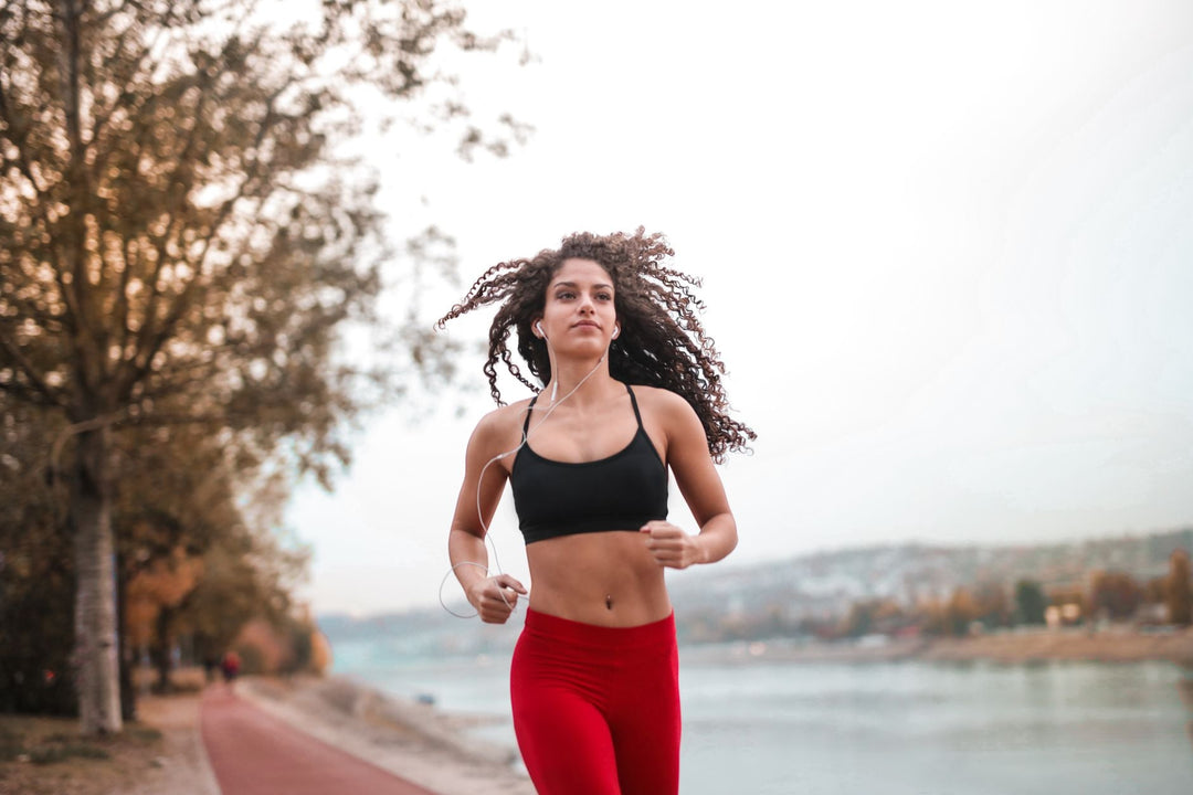 runner on a riverside morning road run