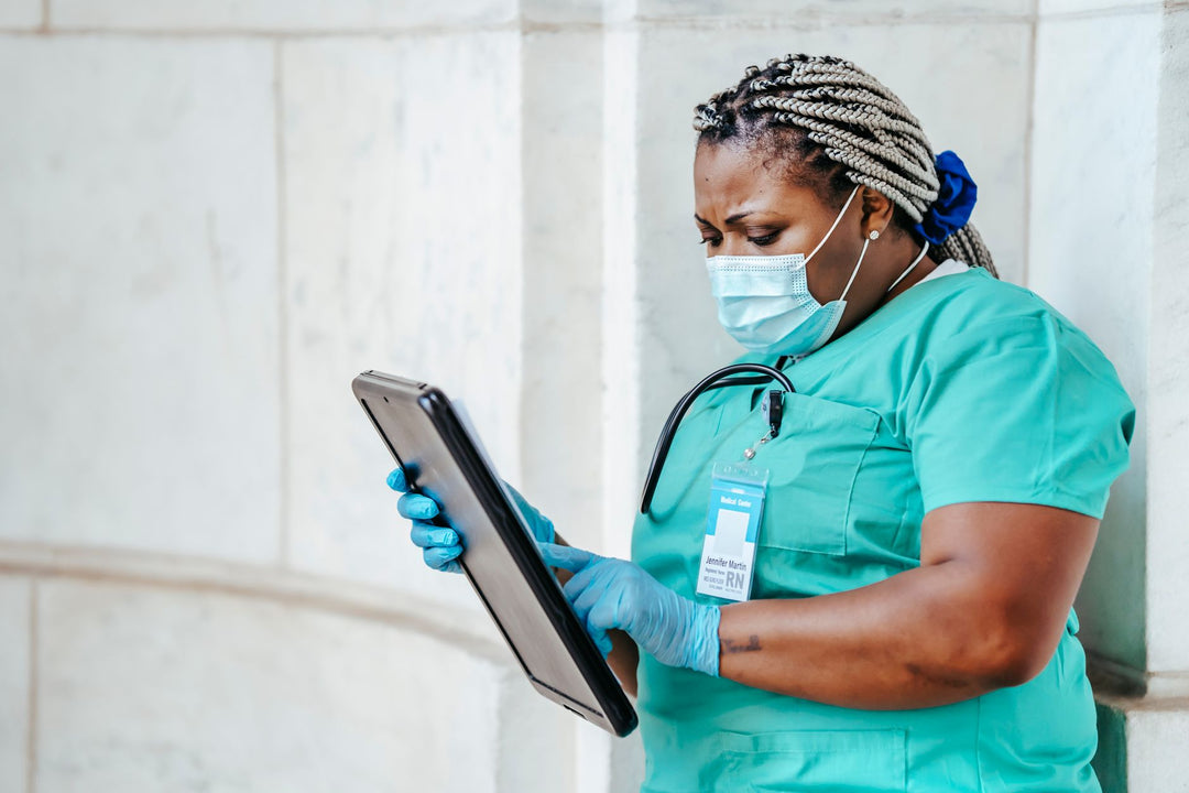 nurse in medical uniform walking through a hospital hallway during a long shift